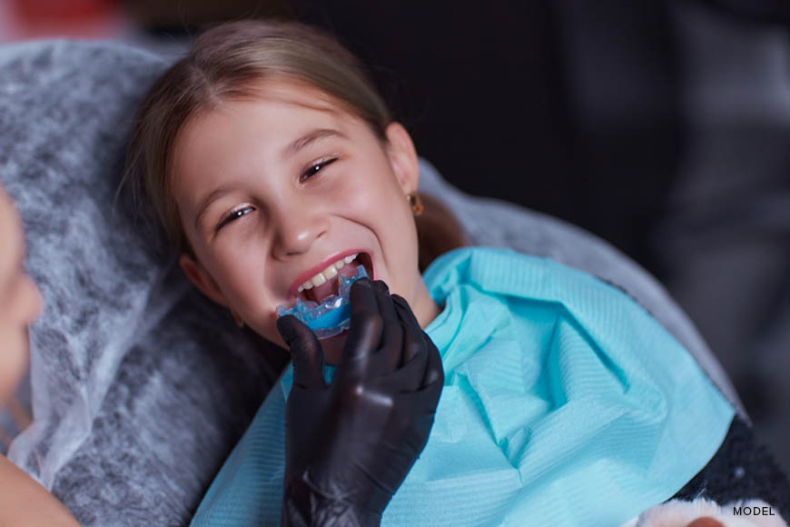 protect child's teeth with custom mouthguard